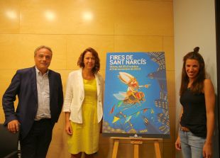 Un jove Sant Narcís sobrevola Girona damunt una mosca en el cartell d'enguany