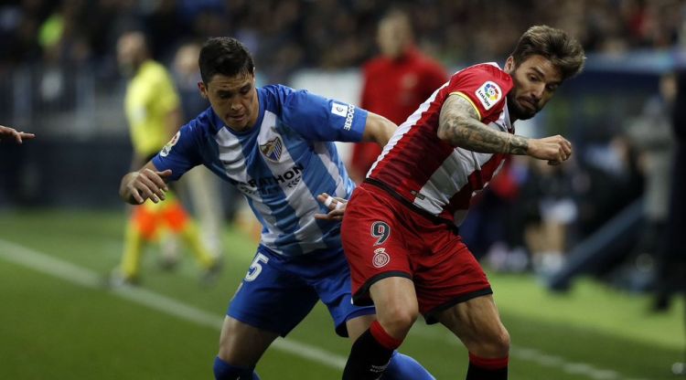 Portu en una disputa durant el partit. Girona FC